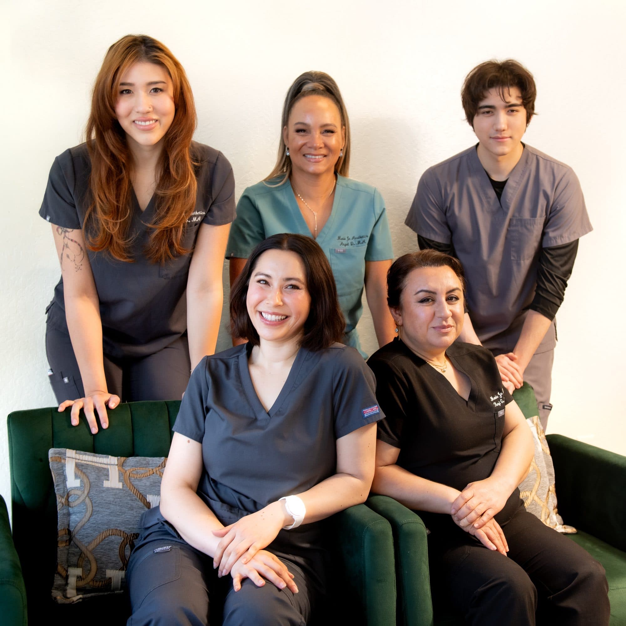 The Marie Jé Aesthetics team gathered in the studio lounge